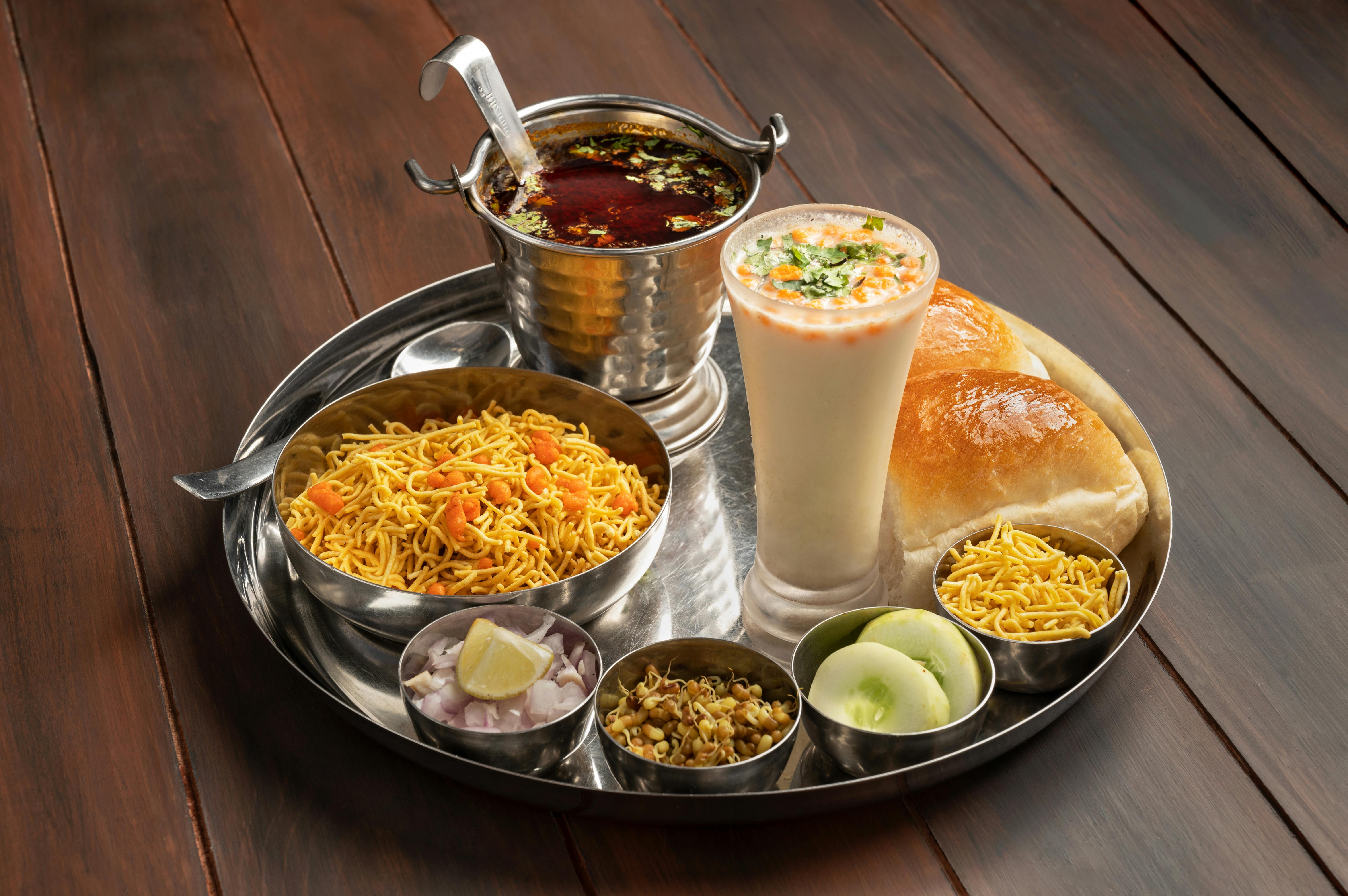 Preparing hot spicy Misal